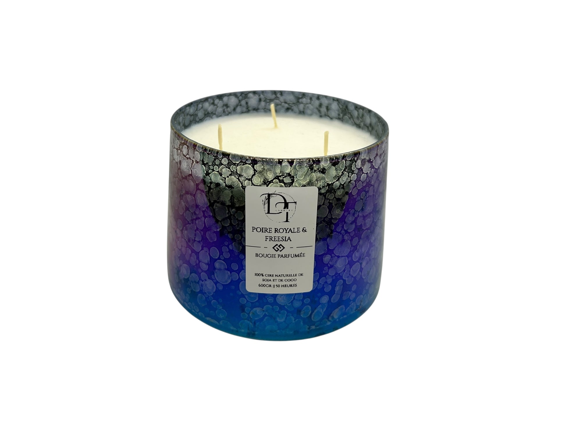 Candle in a decorative glass jar with a visible brand label on a white background