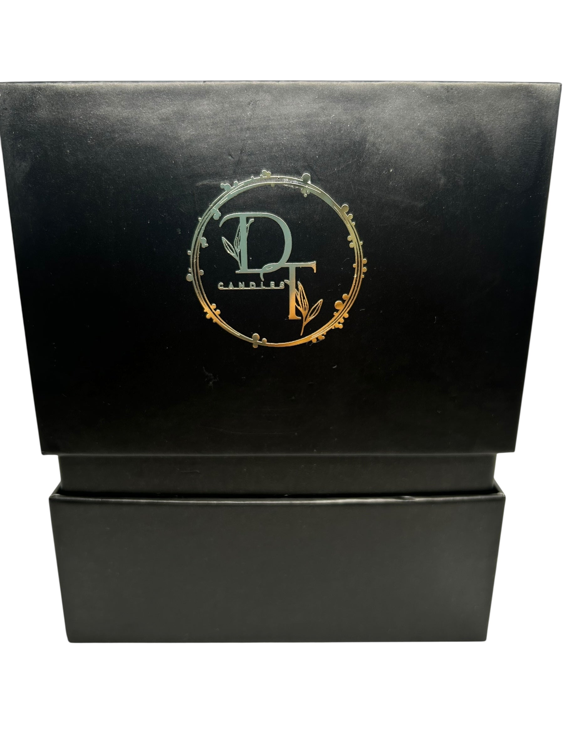 Black box with gold logo on a white background