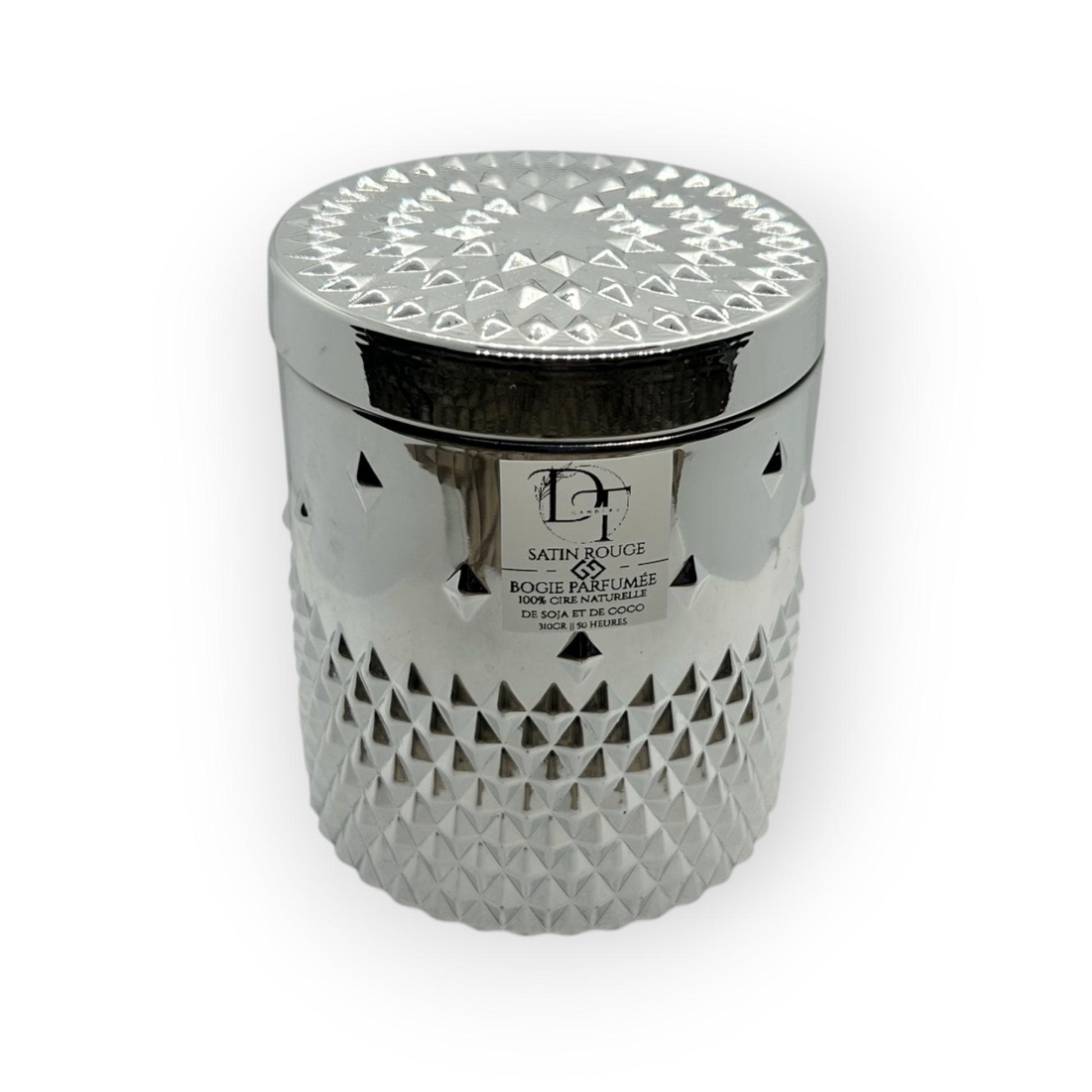 Decorative candle in a silver container with geometric pattern on a white background