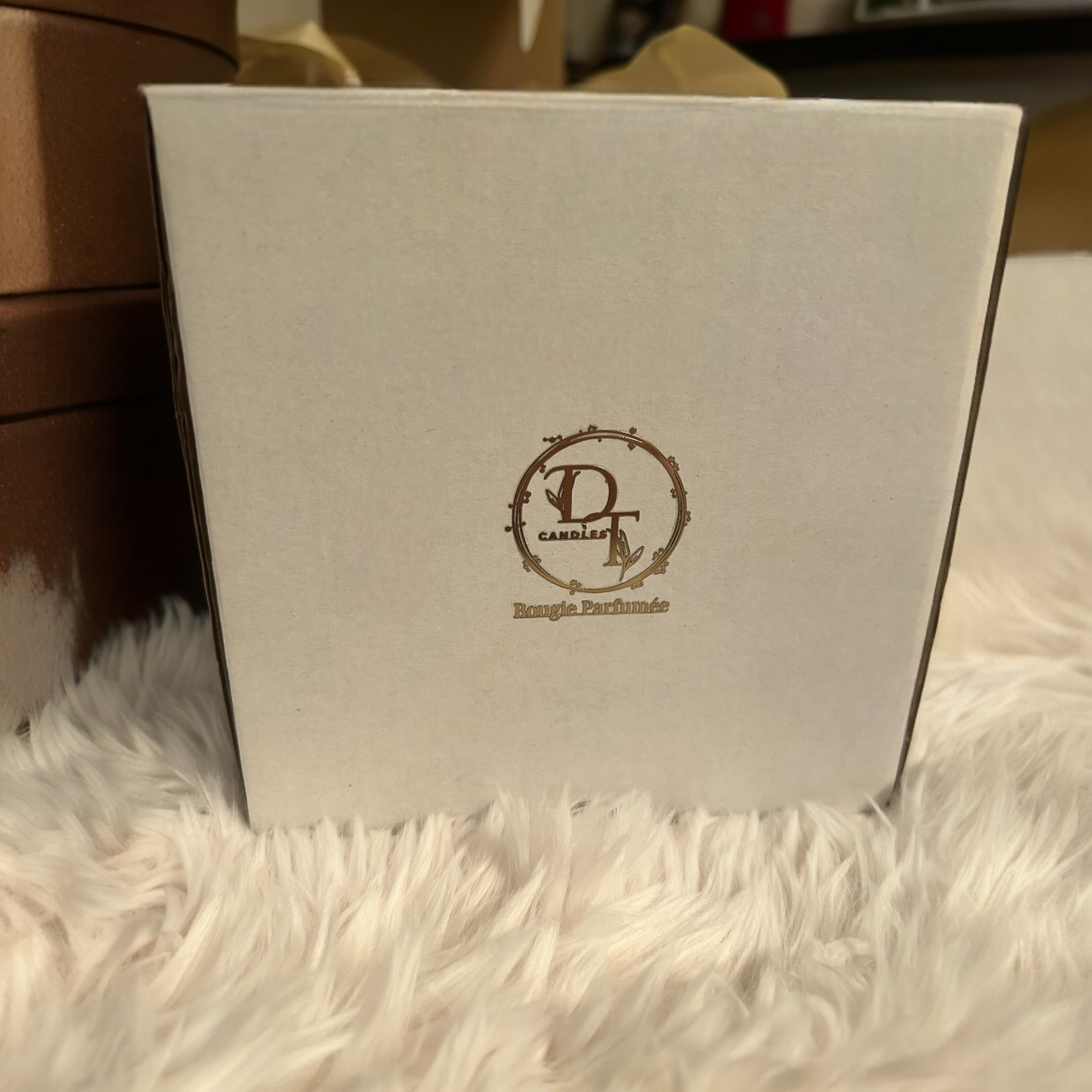 White box with a logo on a fluffy white surface